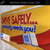 Vintage GM Drive Safely Seatbelt Embossed Tin Sign