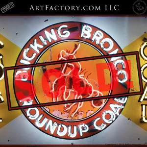 Explore this original vintage advertising sign from Roundup Coal Mining, featuring bold yellow, white, and red colors with an iconic bucking bronco design—perfect Americana collectible.